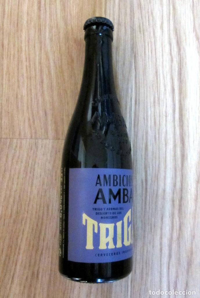 Coleccionismo de cervezas: BOTELLA CERVEZA VACIA RELIEVE SERIGRAFIADA AMBAR LA ZARAGOZANA AMBICIOSAS TRIGAL TRIGO CHAPA