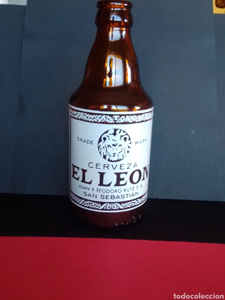 Coleccionismo de cervezas: ANTIGUA BOTELLA DE CERVEZA EL LE&Oacute;N. TERCIO. SAN SEBASTI&Aacute;N.