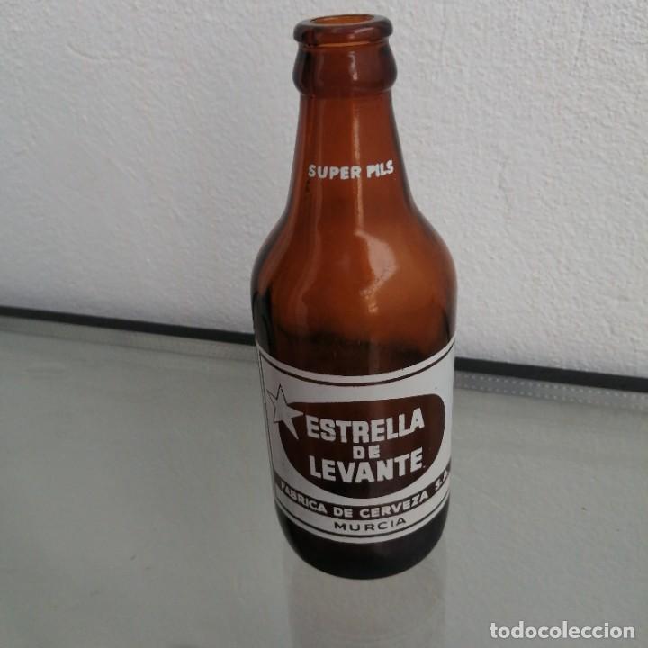Coleccionismo de cervezas: Botella de cerveza del a&ntilde;o 1970 ESTRELLA DE LEVANTE Murcia tercio de 33 cl Serigrafiada