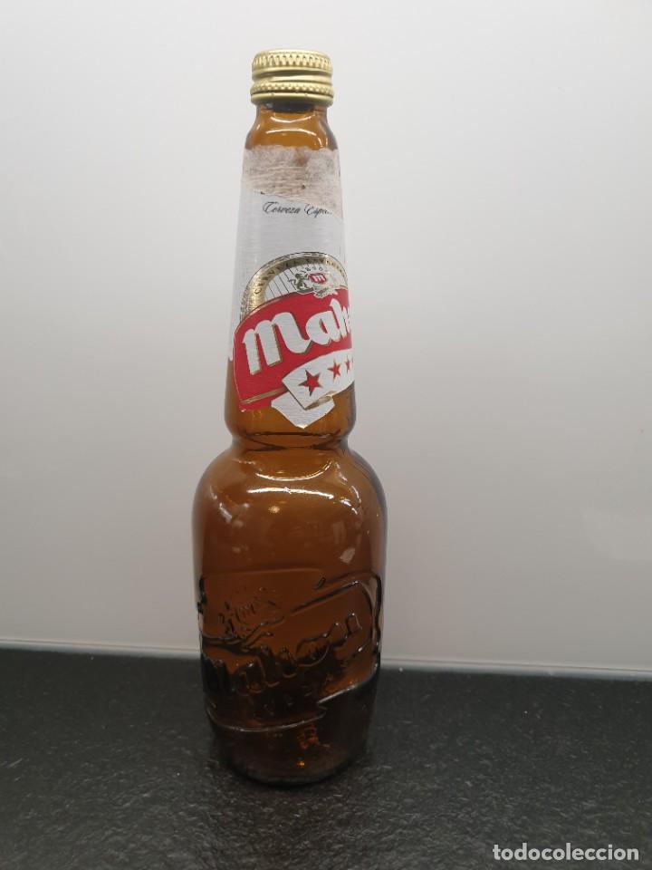Coleccionismo de cervezas: Botella de Cristal Mahou 5 estrellas con relieve.