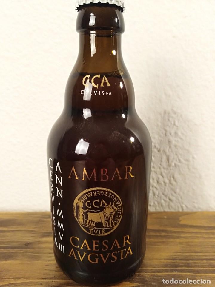 Coleccionismo de cervezas: Botella cerveza llena AMBAR CESAR AUGUSTA chapa sin abrir seregrafiada La Zaragozana