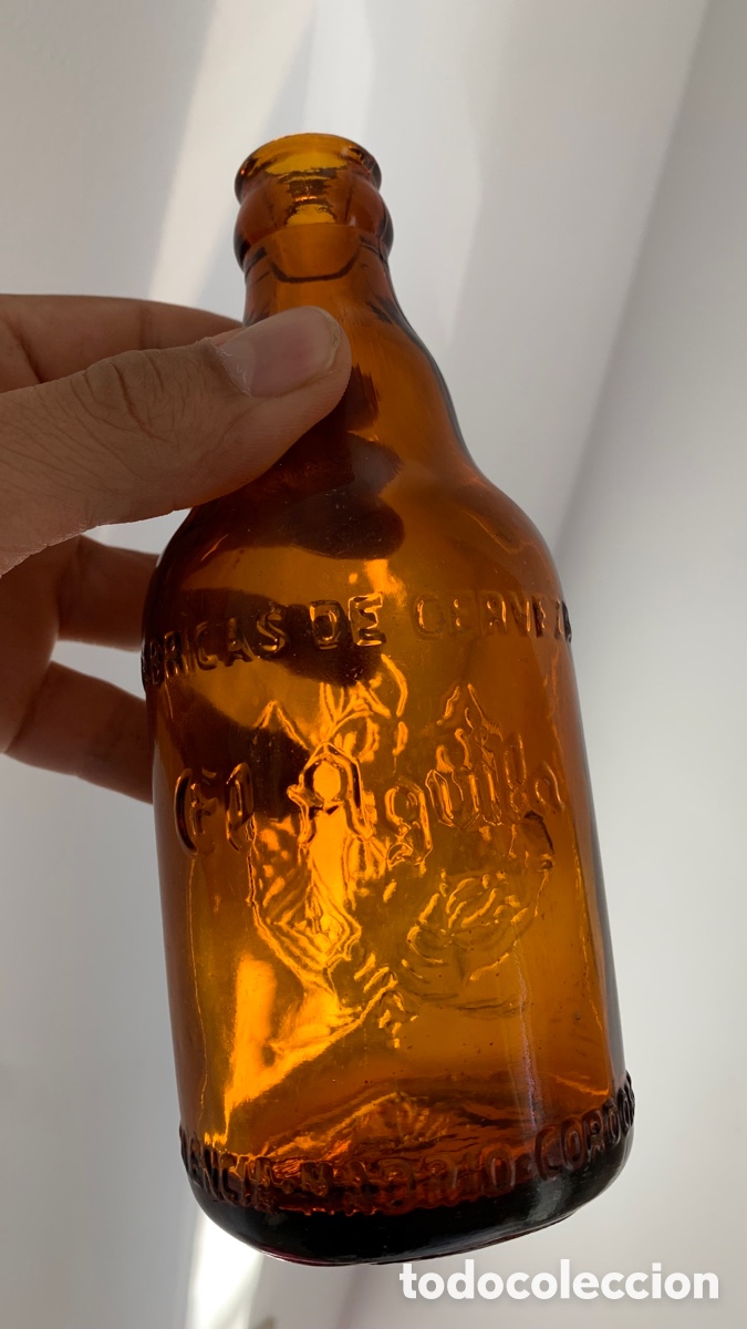 Coleccionismo de cervezas: ANTIGUA BOTELLA DE CERVEZA EL &Aacute;GUILA, RELIEVE