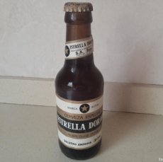 Coleccionismo de cervezas: ANTIGUA BOTELLA SIN ABRIR ESTRELLA DORADA DAMM PILSEN