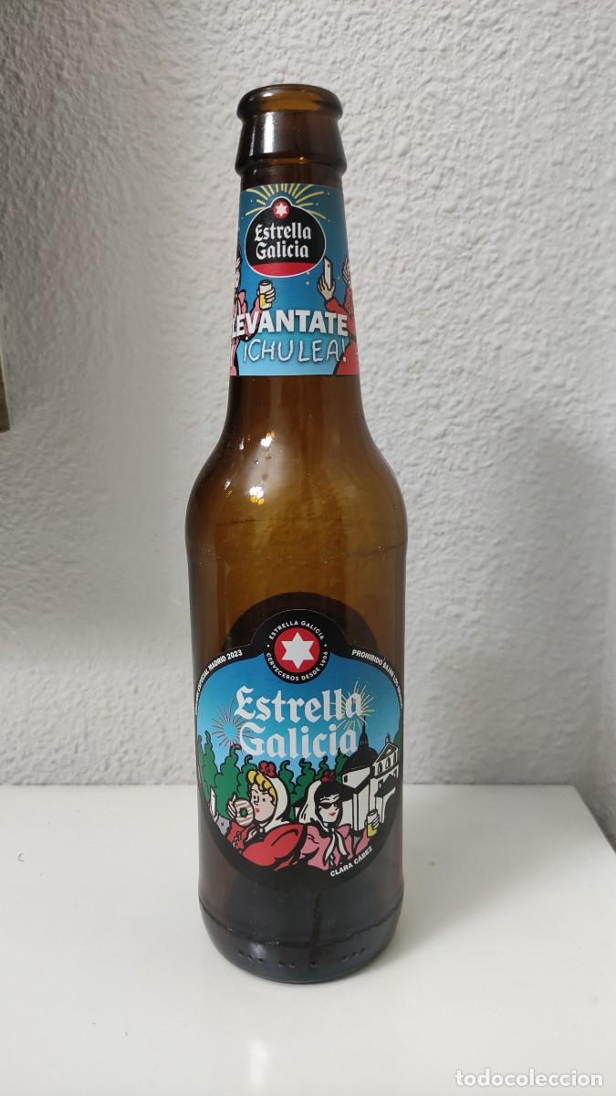 Coleccionismo de cervezas: BOTELLA CERVEZA VACIA - ESTRELLA GALICIA - LEVANTATE Y CHULEA - MADRID