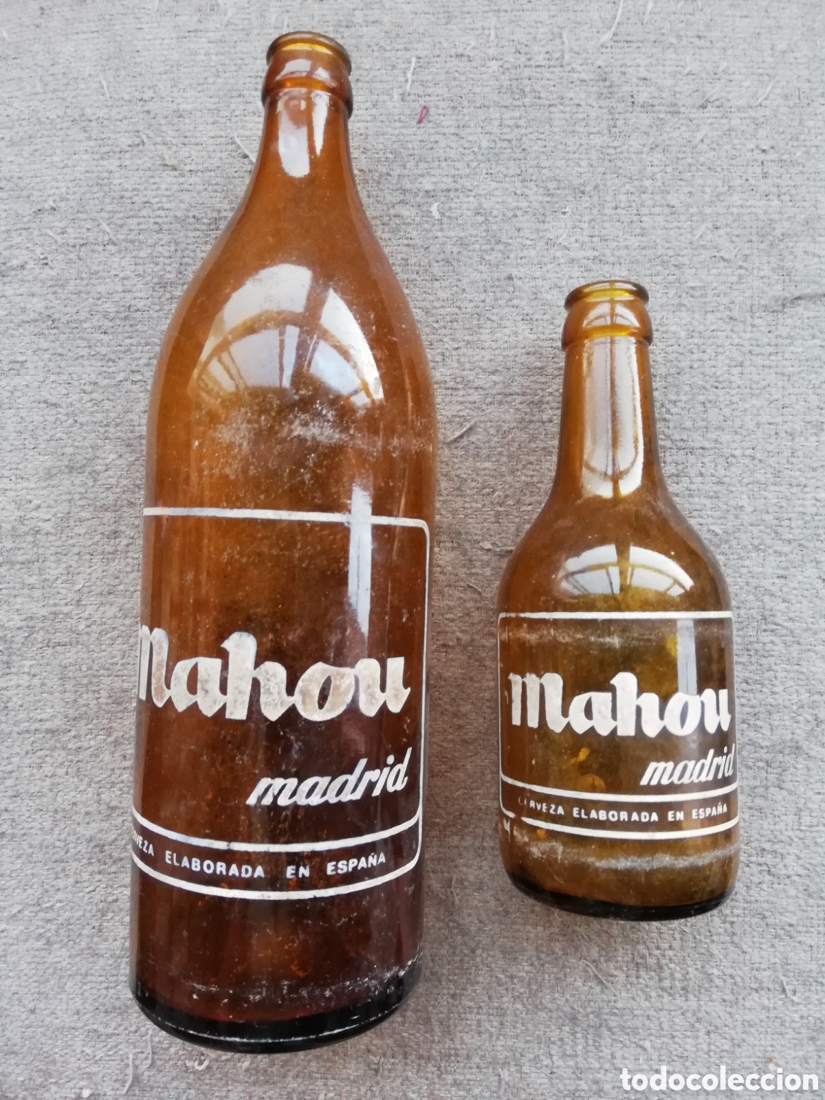 Coleccionismo de cervezas: Botella de litro y botell&iacute;n de tercio de cerveza Mahou Madrid. Elaborada en Espa&ntilde;a