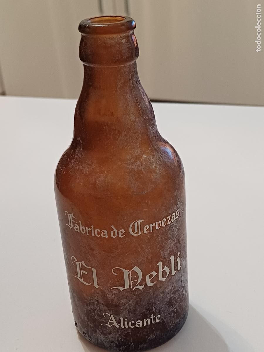 Coleccionismo de cervezas: ANTIGUA BOTELLA CERVEZAS EL NEBLI BOTELLIN CRISTAL ALICANTE PUBLICIDAD COLECCION RETRO