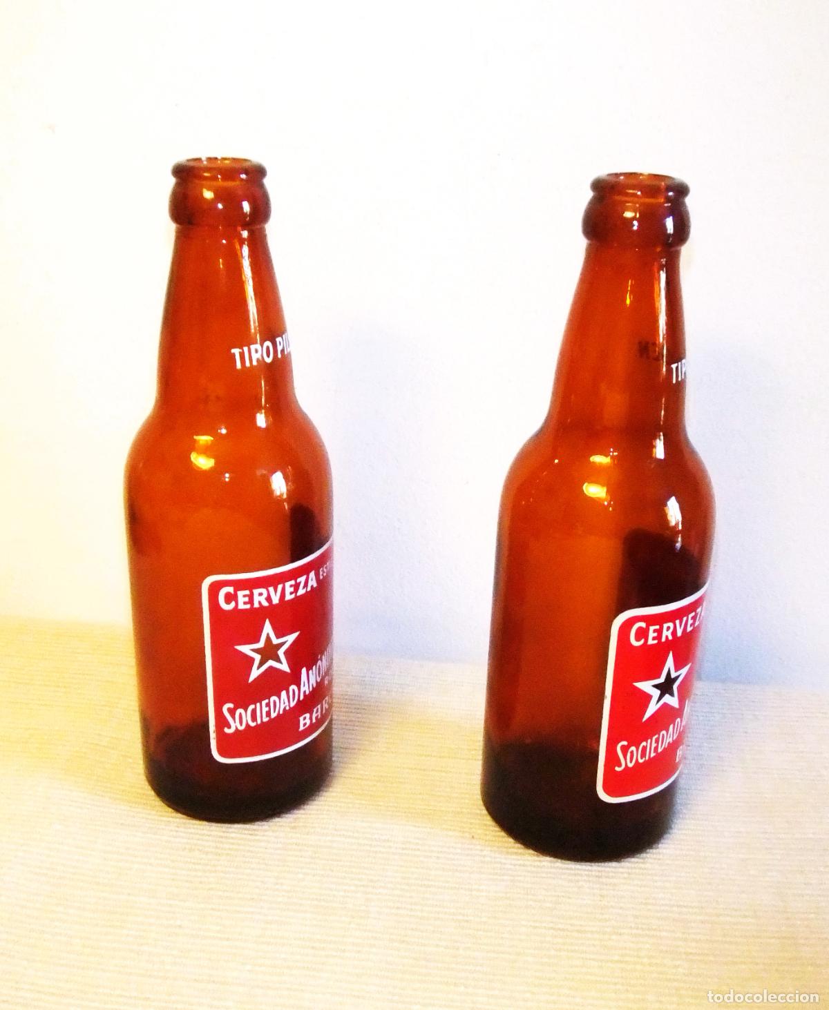 Coleccionismo de cervezas: DOS ANTIGUAS BOTELLAS DE ESTRELLA DAMM SERIGRAFIADAS - Foto 2