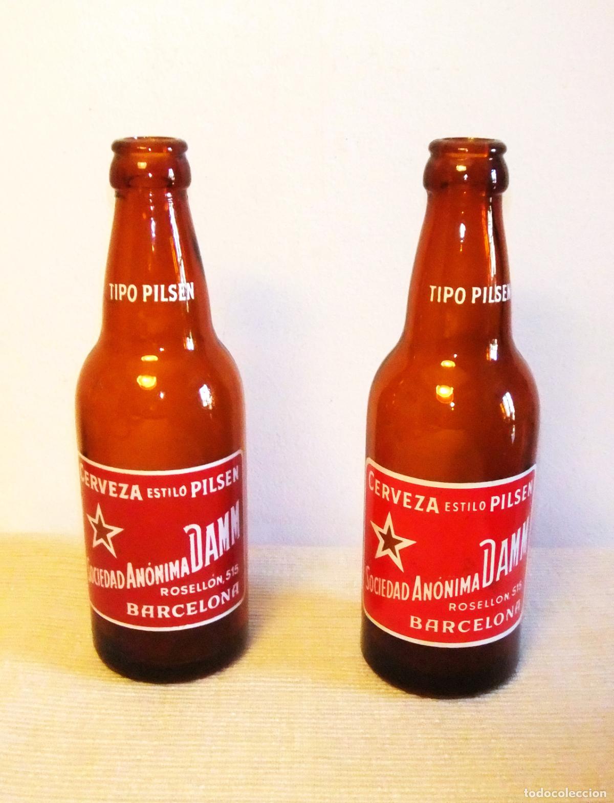 Coleccionismo de cervezas: DOS ANTIGUAS BOTELLAS DE ESTRELLA DAMM SERIGRAFIADAS - Foto 1
