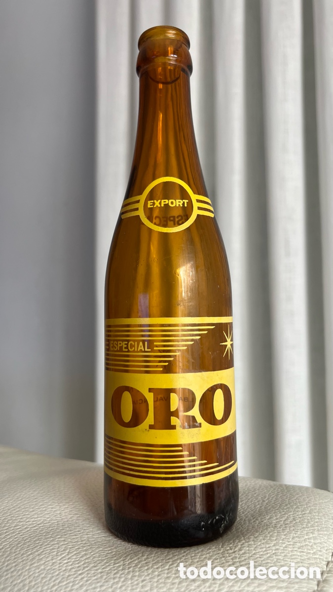 Coleccionismo de cervezas: ANTIGUA BOTELLA DE CERVEZA ORO TERCIO 1/3