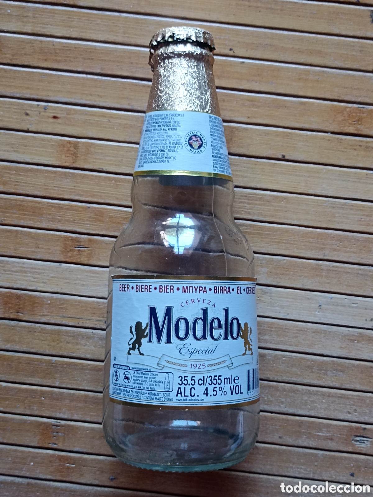 Coleccionismo de cervezas: Botella cerveza Modelo M&eacute;xico vac&iacute;a con chapa 355 ml