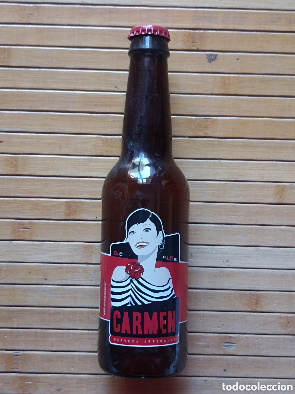 Coleccionismo de cervezas: Botella cerveza Carmen artesanal vac&iacute;a con chapa 330 ml