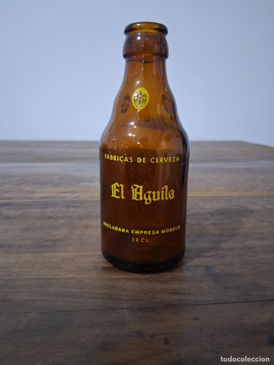 Coleccionismo de cervezas: Botella de cerveza El aguila quinto 20 cl especial