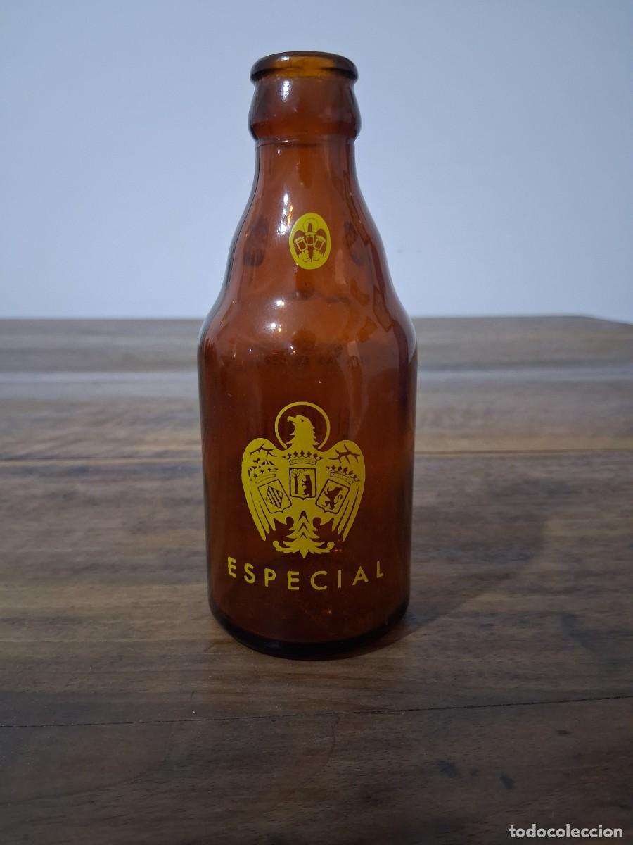 Coleccionismo de cervezas: Botella de cerveza El aguila quinto 20 cl especial