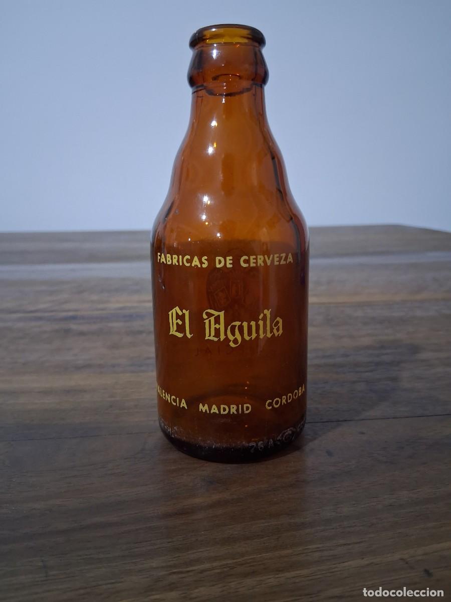 Coleccionismo de cervezas: Botella de cerveza El aguila quinto 20 cl especial Valencia Madrid C&oacute;rdoba