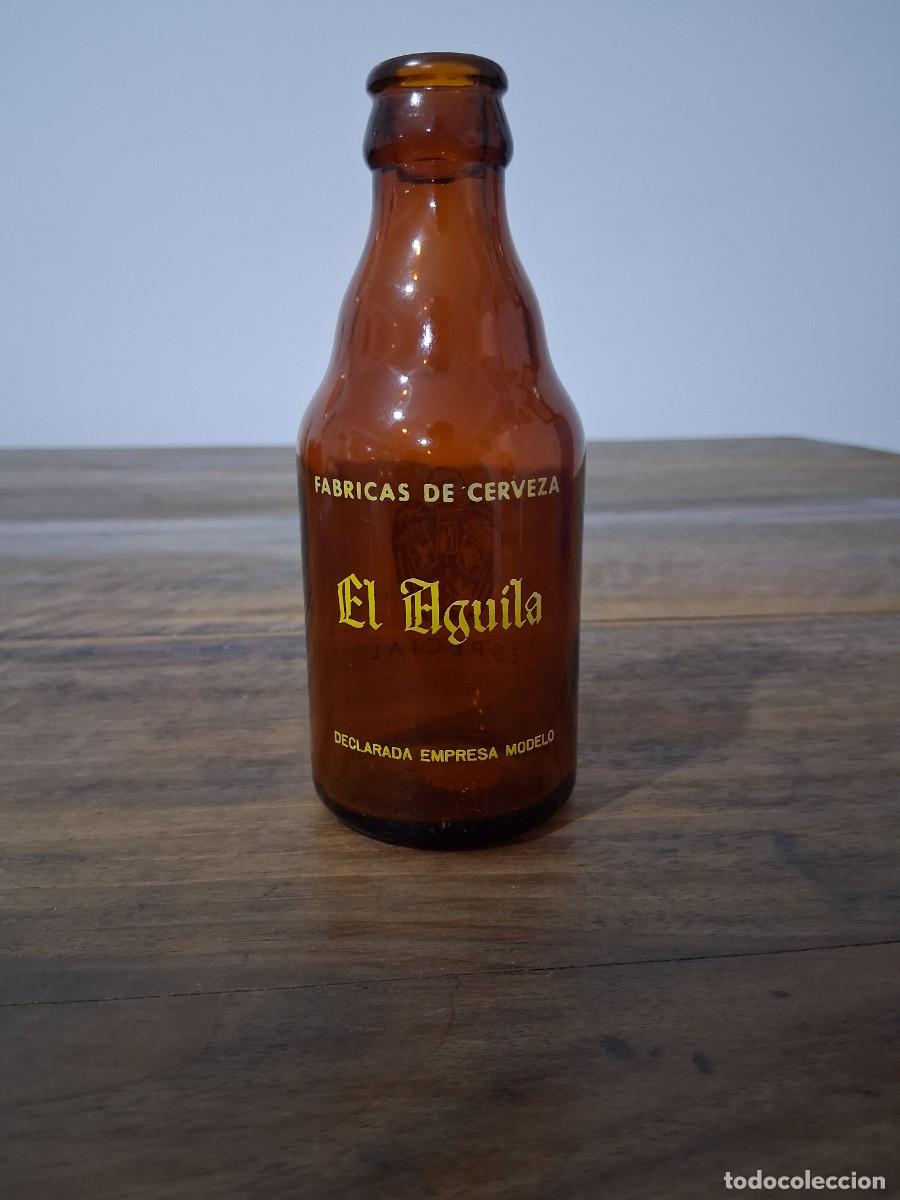 Coleccionismo de cervezas: Botella de cerveza El aguila quinto 20 cl especial Valencia Madrid C&oacute;rdoba