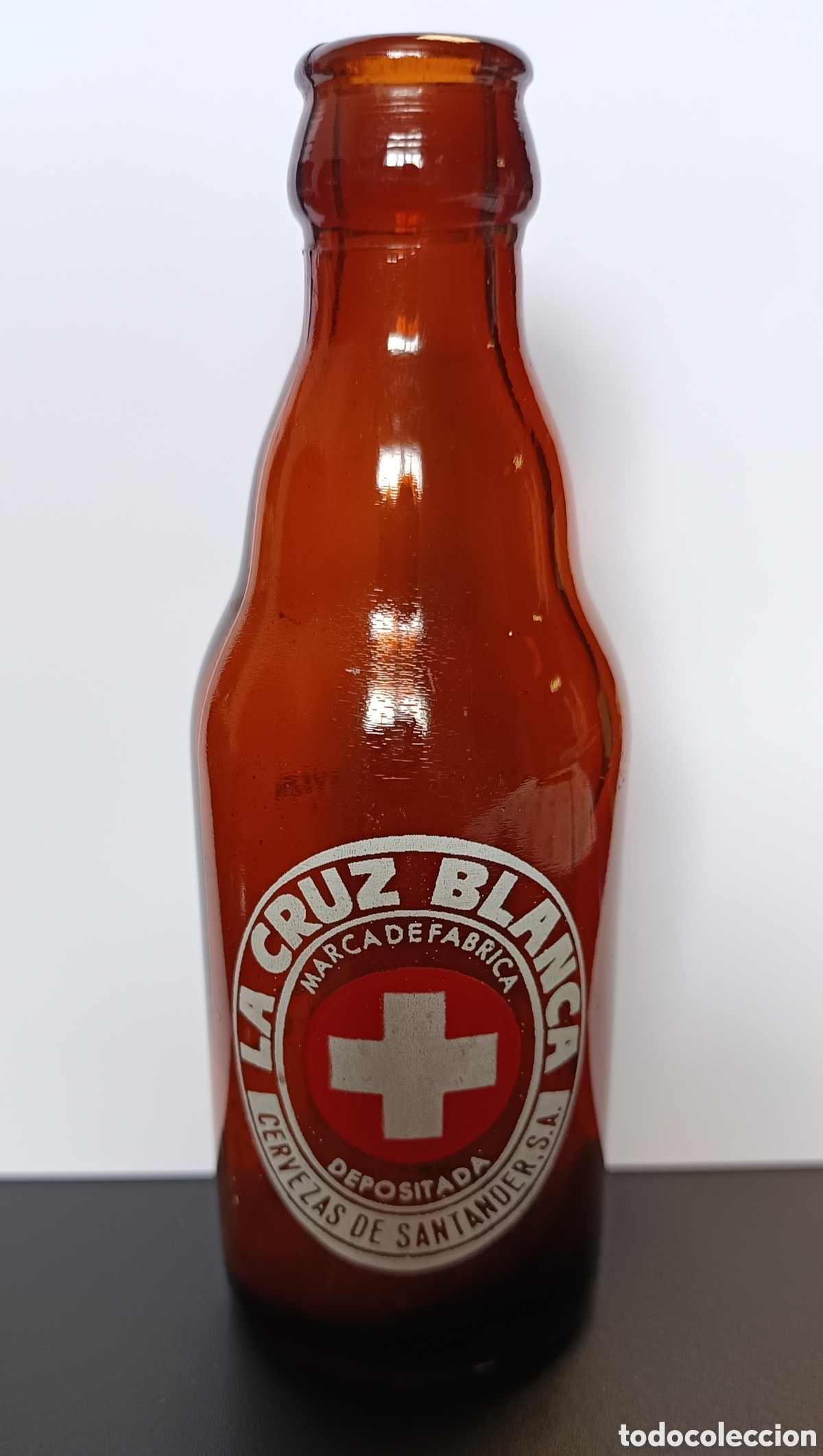 Coleccionismo de cervezas: Botella antigua cerveza La Cruz Blanca