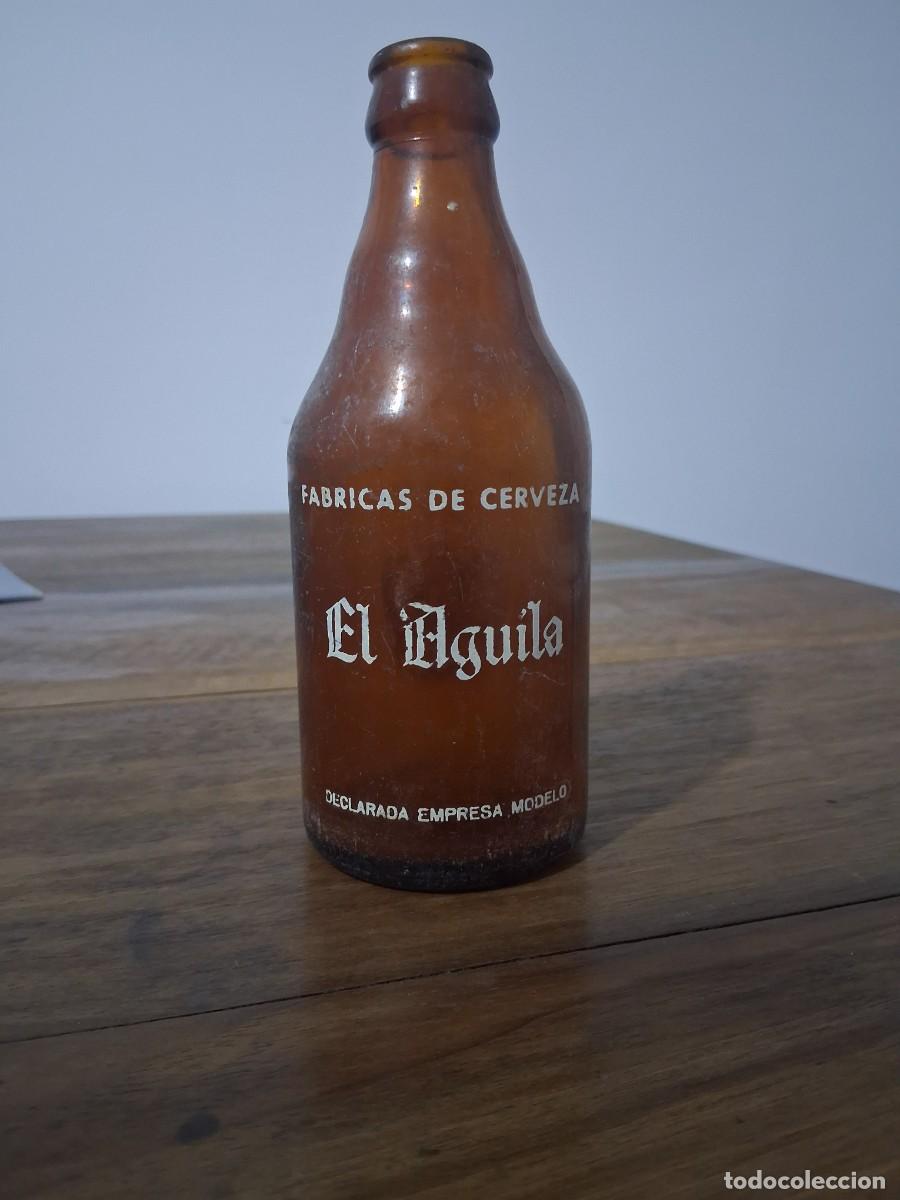 Coleccionismo de cervezas: Botella de cerveza El aguila tercio - Foto 1