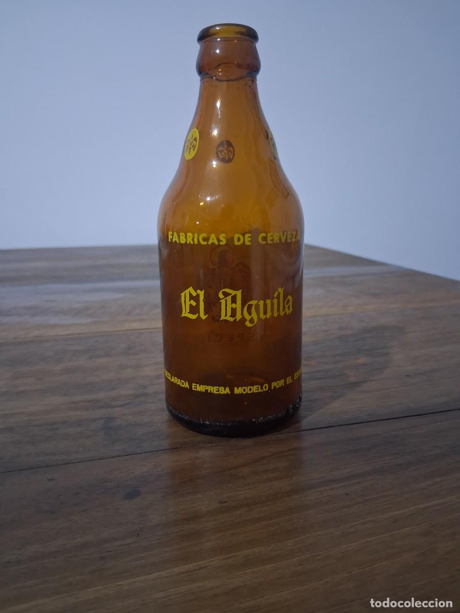 Coleccionismo de cervezas: Botella de cerveza El aguila tercio declarada empresa modelo por estado &eacute;poca dictadura franquista