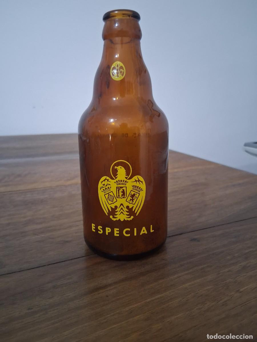 Coleccionismo de cervezas: Botella de cerveza El aguila tercio especial sin collar&iacute;n