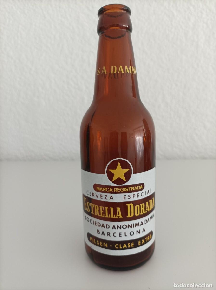 Coleccionismo de cervezas: Antigua botella estrella dorada damm