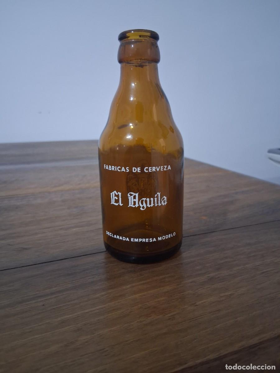 Coleccionismo de cervezas: Botella de 20 cl cerveza EL AGUILA quinto del a&ntilde;o 1967