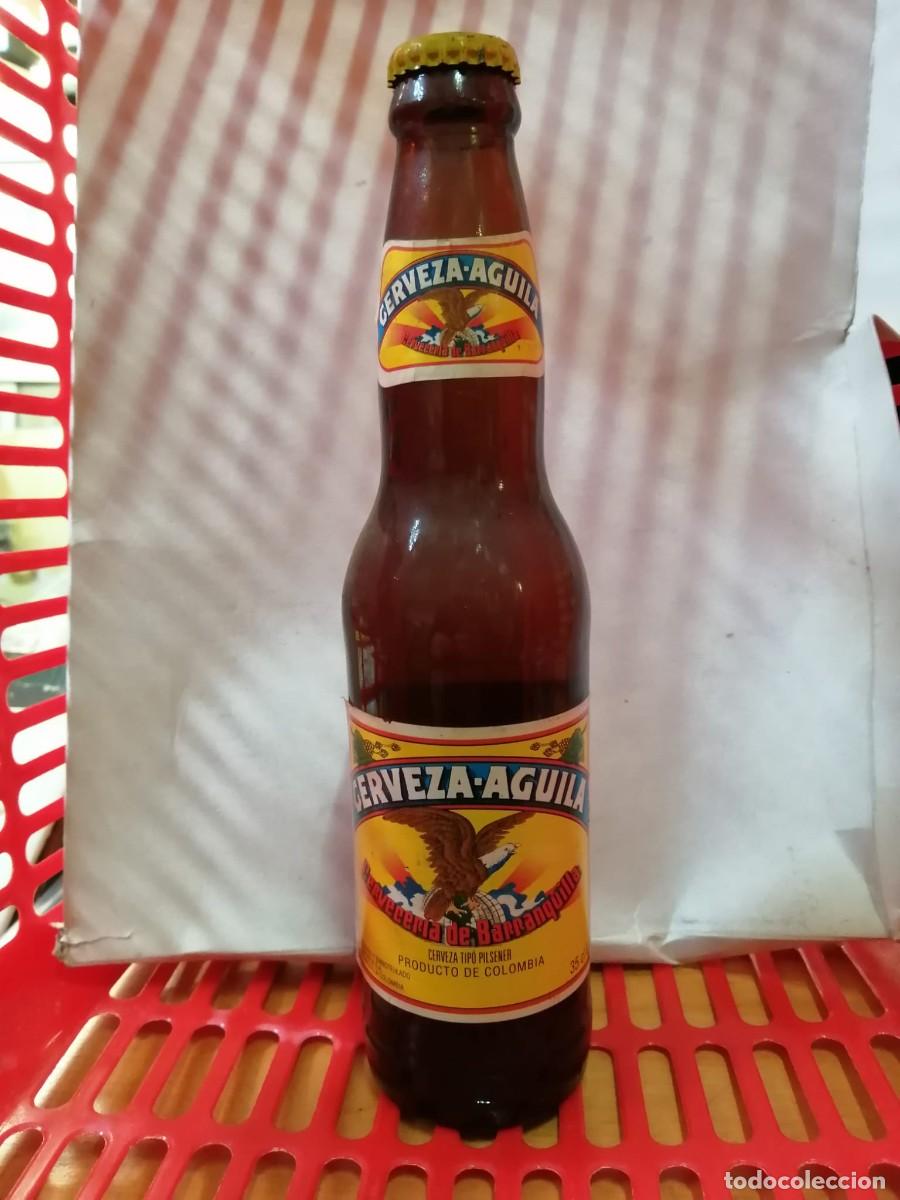 Coleccionismo de cervezas: BOTELLA DE CERVEZA (LLENA) AGUILA, BARRANQUILLA