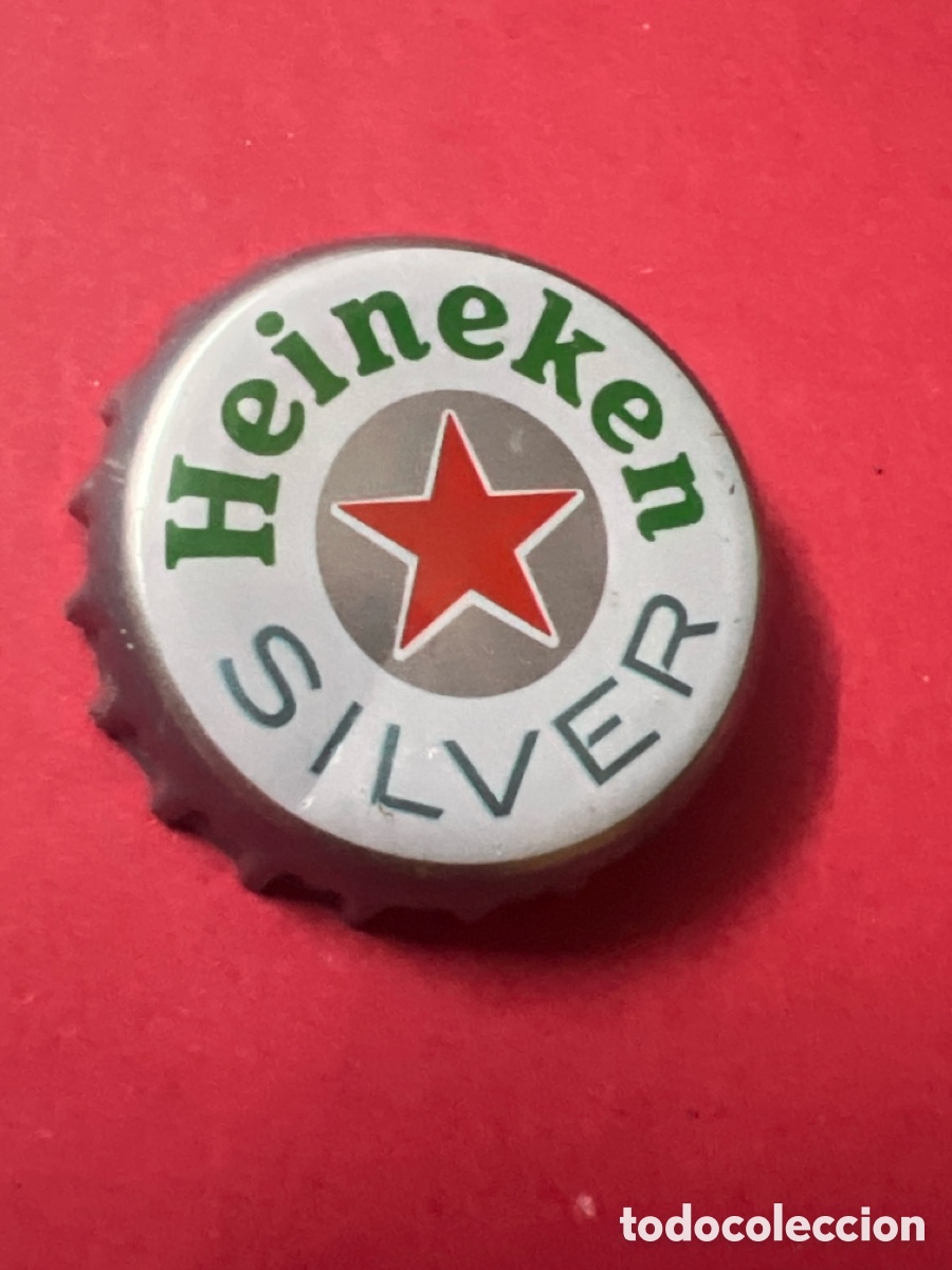 Coleccionismo de cervezas: E1067. Chapa tap&oacute;n corona de la cerveza de Pa&iacute;ses Bajos HEINEKEN SILVER