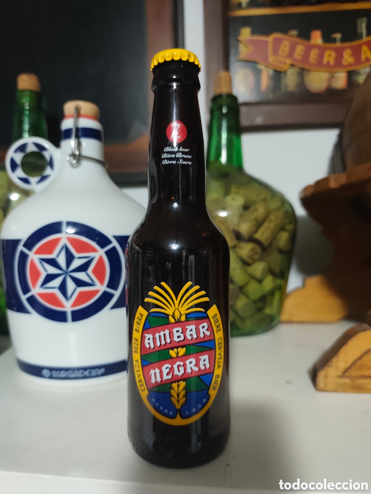 Coleccionismo de cervezas: Botella cerveza &aacute;mbar negra vac&iacute;a