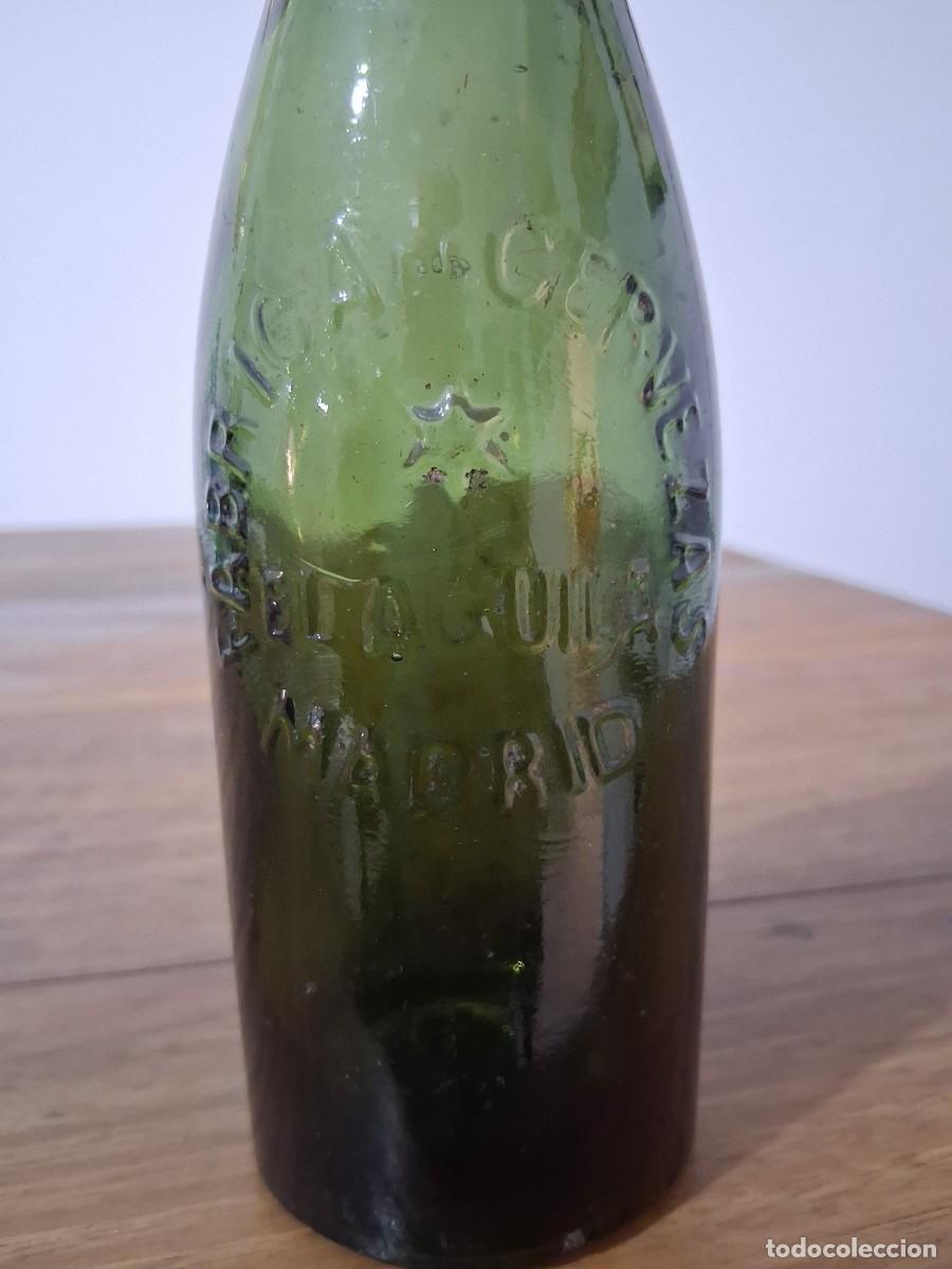 Coleccionismo de cervezas: Botella en relieve cerveza El aguila tercio tapon de corcho