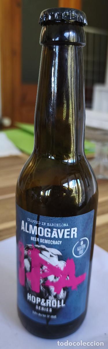 Coleccionismo de cervezas: BOTELLA VACIA con etiqueta y CHAPA TAPON CORONA CERVEZA - ALMOG&Agrave;VER - HOP & ROLL Barcelona