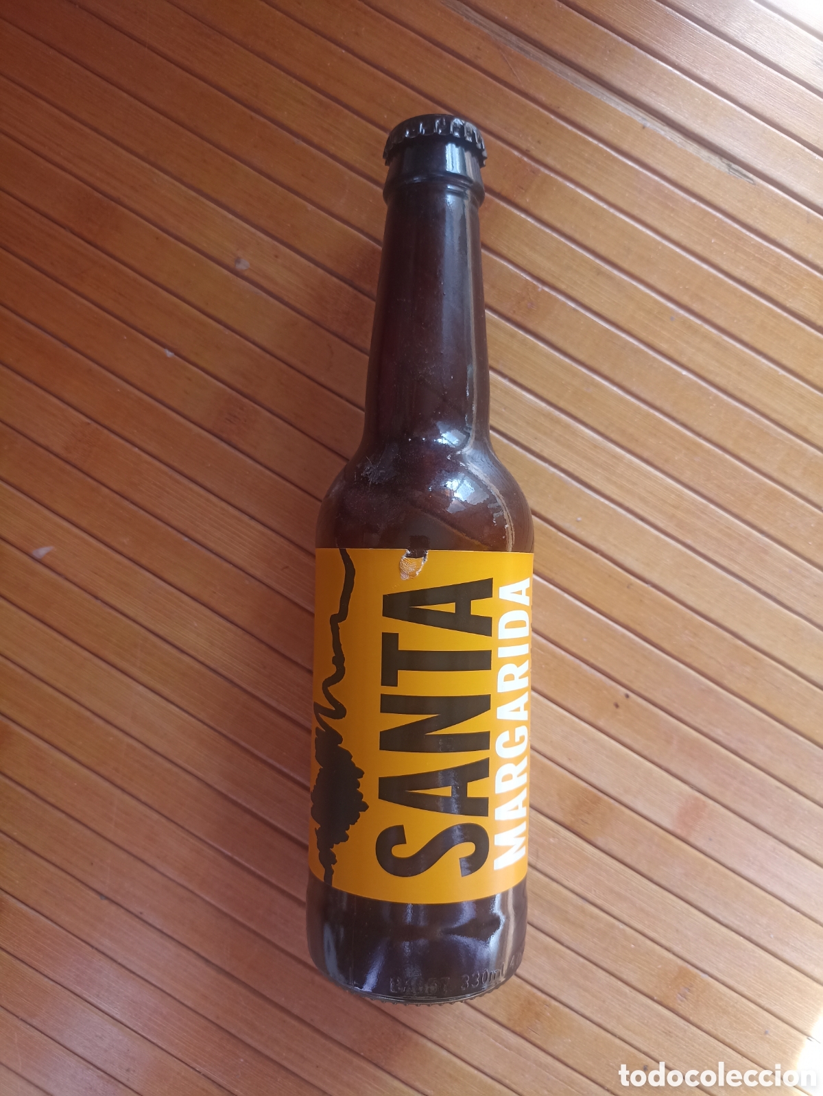 Coleccionismo de cervezas: Botella cerveza Santa Margarida artesanal de trigo Girona vac&iacute;a con chapa 330 ml