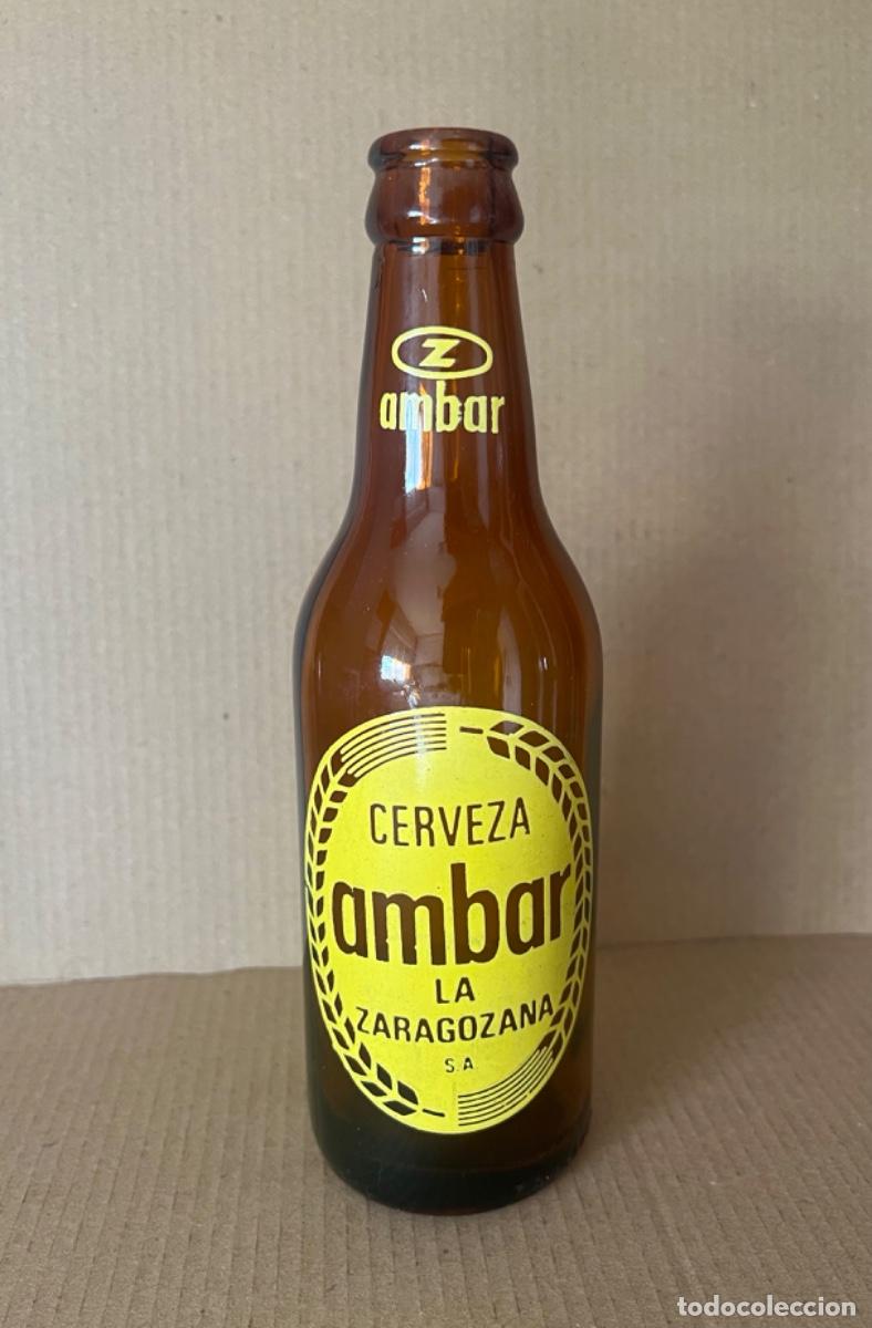 Coleccionismo de cervezas: Botella de tercio CERVEZA AMBAR con letras en relieve ZARAGOZANA MORITZ