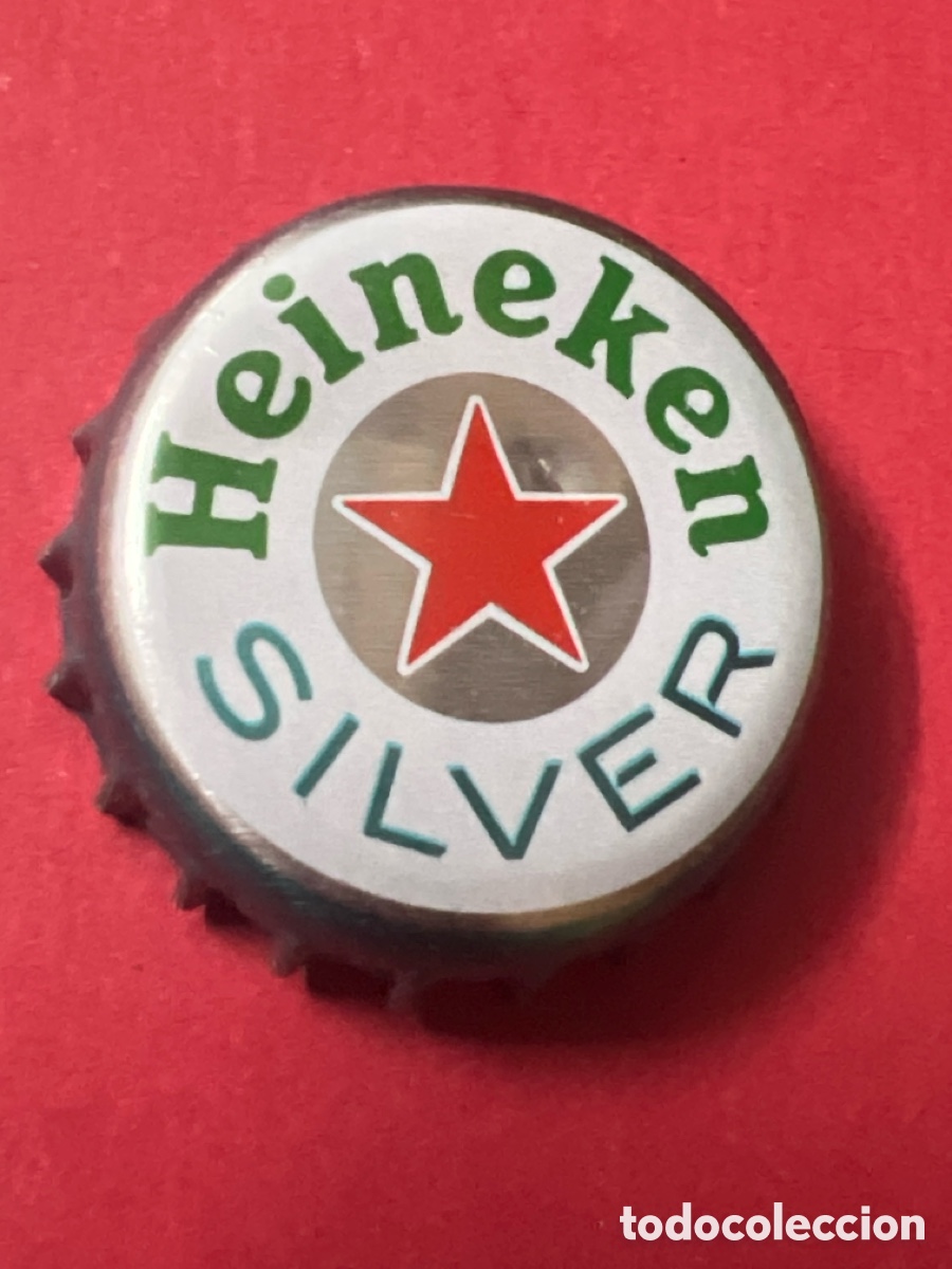 Coleccionismo de cervezas: T4/X59/N4. Chapa tap&oacute;n corona de la cerveza de Pa&iacute;ses Bajos HEINEKEN SILVER