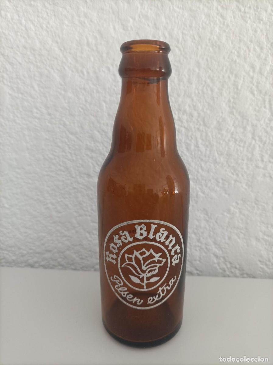 Coleccionismo de cervezas: Botellin de cerveza rosa blanca