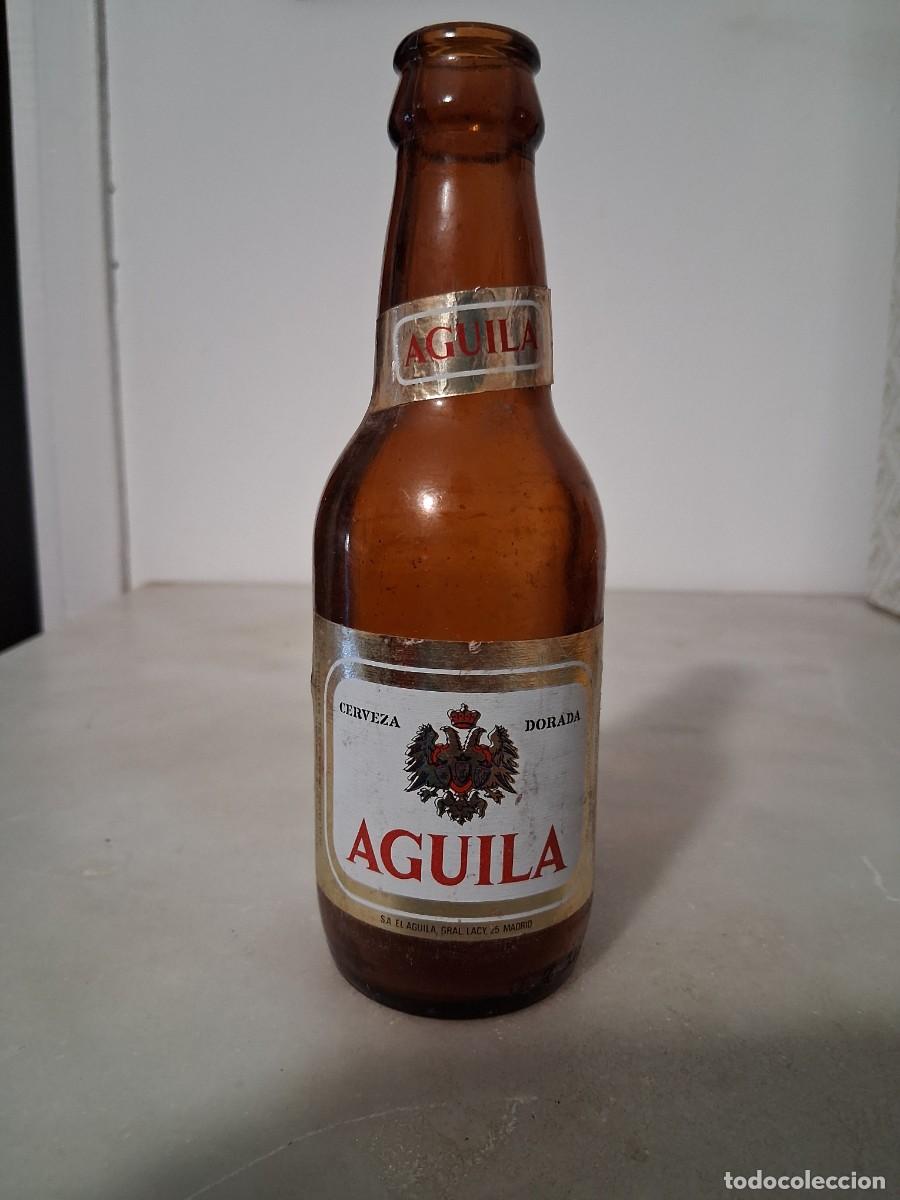 Coleccionismo de cervezas: Botella de cerveza El &aacute;guila dorada etiqueta 20 cl a&ntilde;o 1984 1985 cristal SM San Miguel
