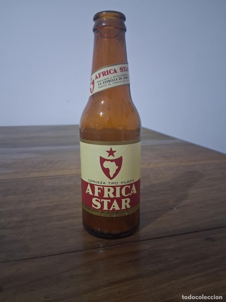 Coleccionismo de cervezas: Botella de cerveza etiqueta La estrella de &Aacute;frica Star Tarajal Ceuta quinto