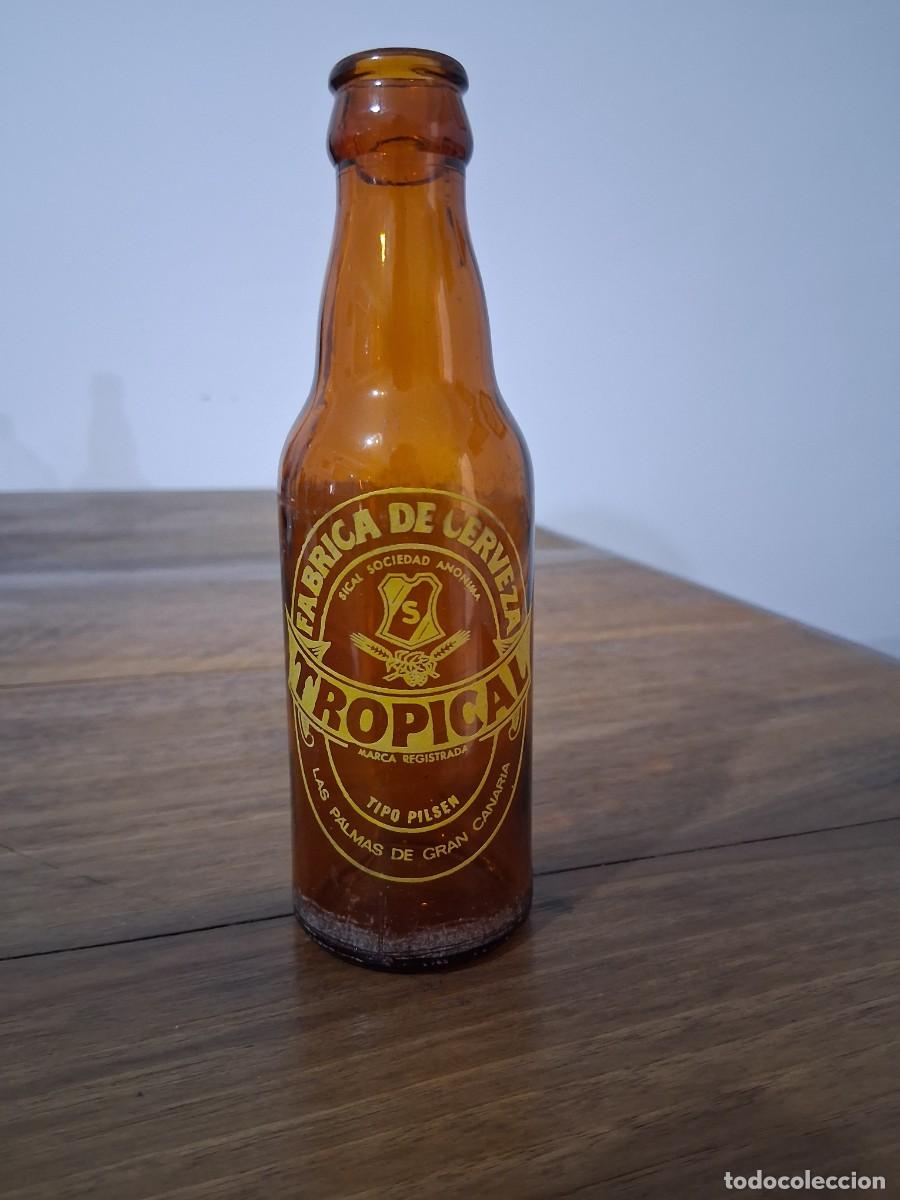Coleccionismo de cervezas: Botella cerveza La tropical Las palmas de Gran Canaria SICAL quinto