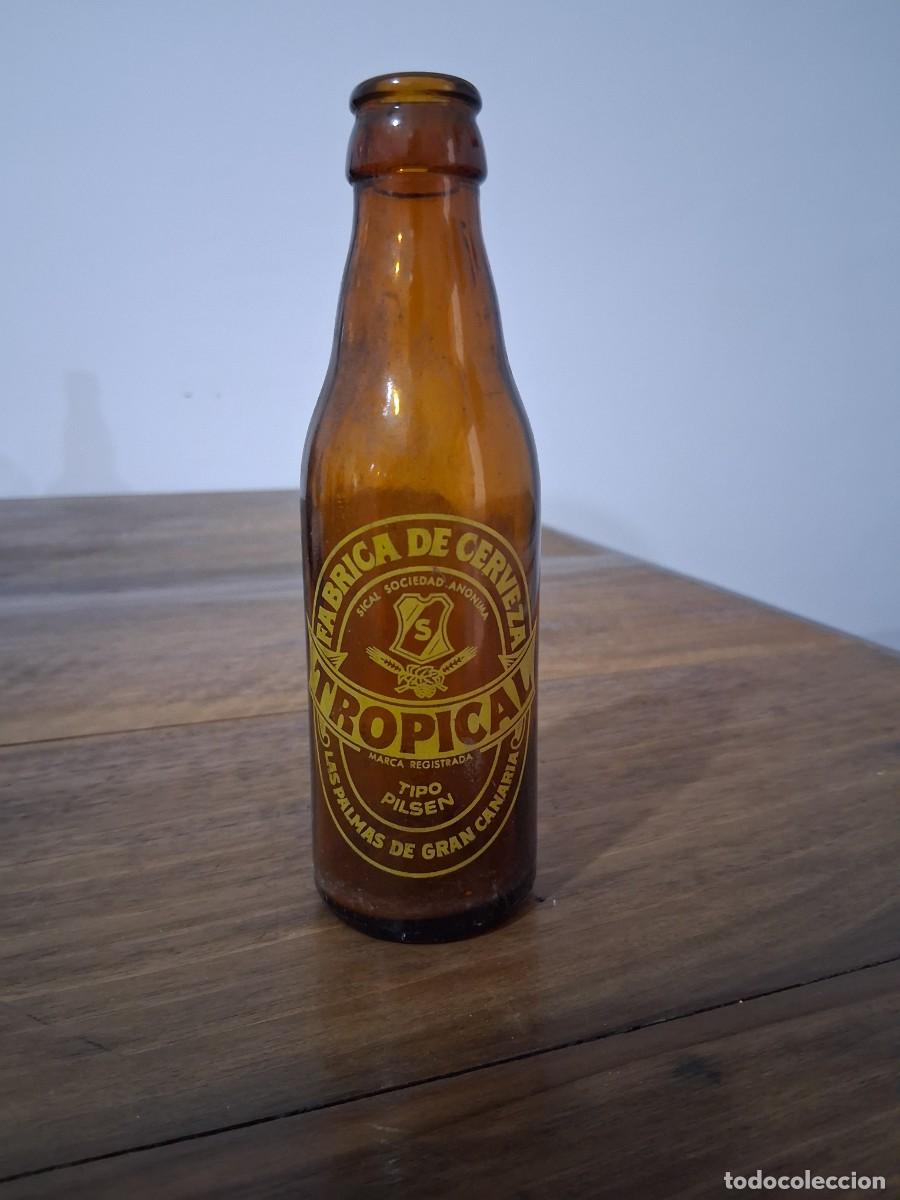 Coleccionismo de cervezas: Botella cerveza La tropical Las palmas de Gran Canaria SICAL quinto