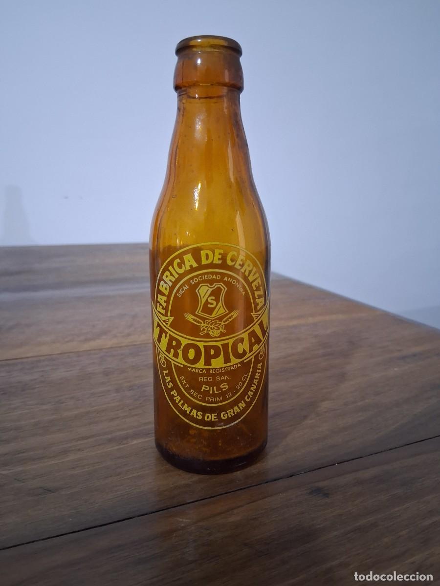 Coleccionismo de cervezas: Botella cerveza La tropical Las palmas de Gran Canaria SICAL quinto