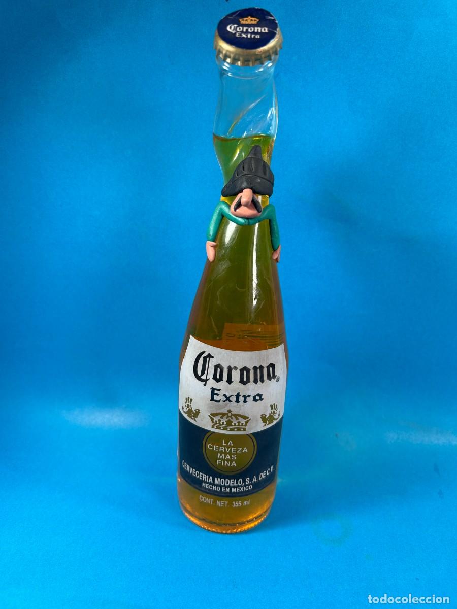 Coleccionismo de cervezas: BOTELLA CERVEZA CORONA EXTRA CUELLO TORCIDO CON MU&Ntilde;ECO