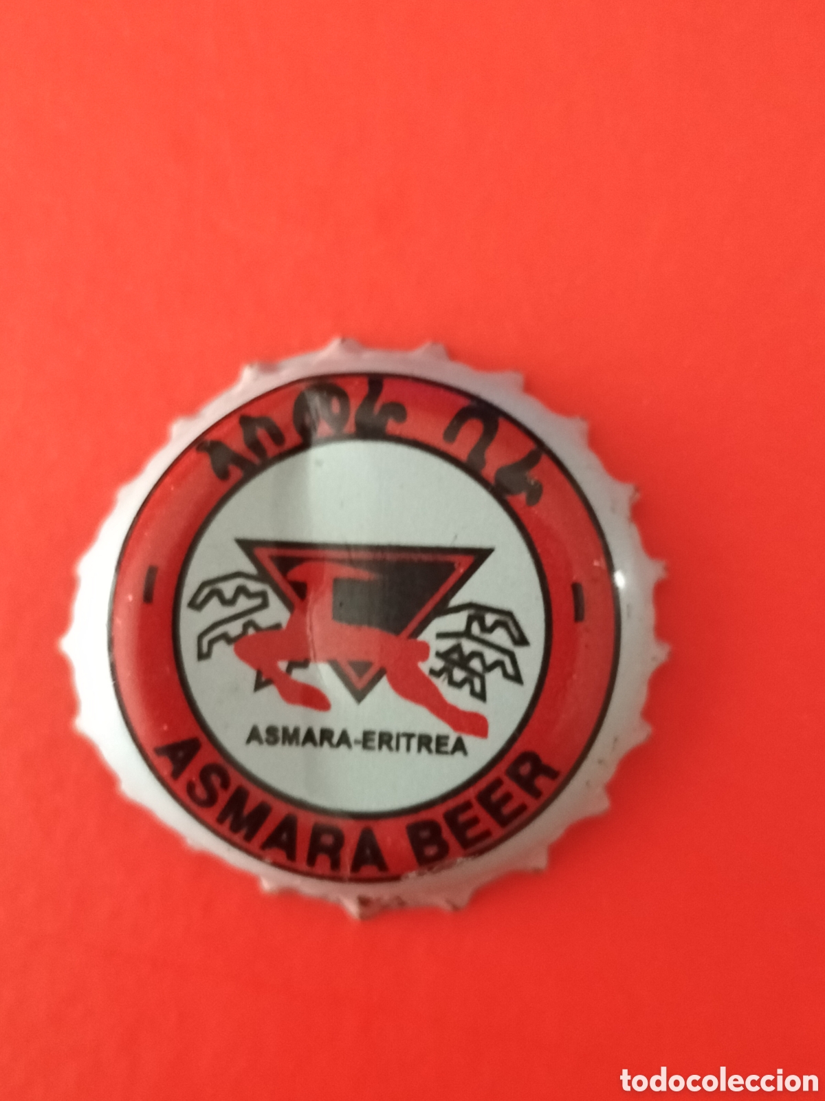 Coleccionismo de cervezas: CHAPA TAP&Oacute;N CORONA CERVEZA ASMARA - ERITREA