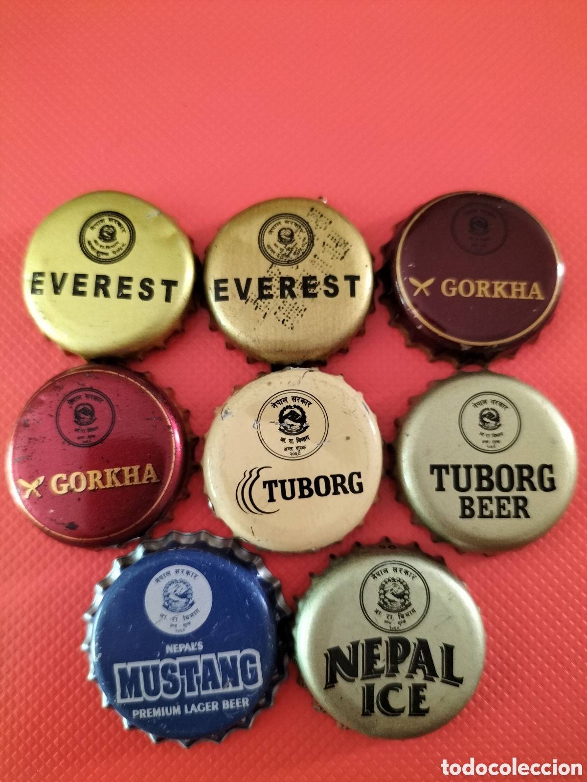 Coleccionismo de cervezas: LOTE 8 CHAPAS TAPON CORONA CERVEZA - NEPAL
