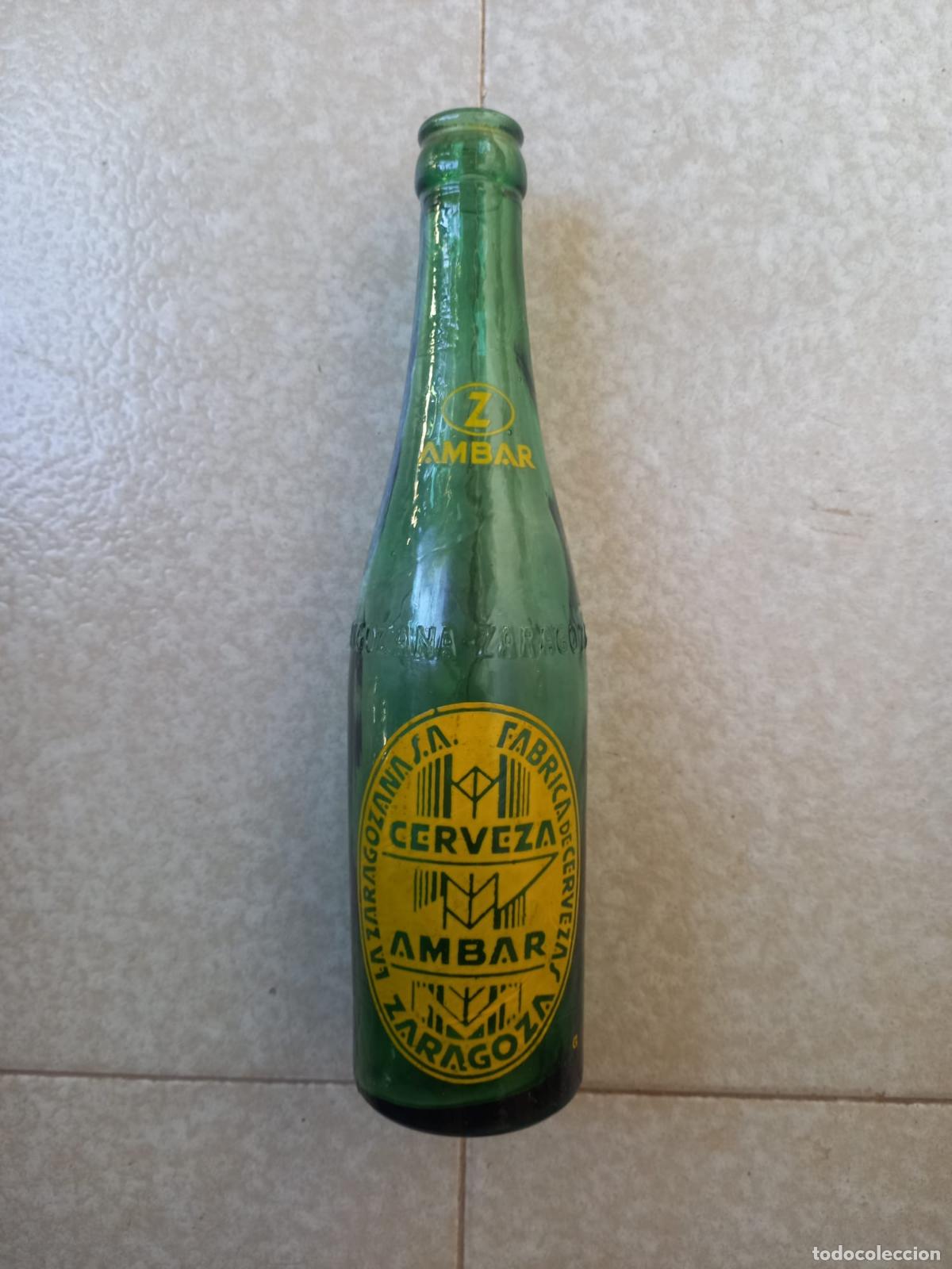 Coleccionismo de cervezas: Botella cerveza AMBAR-LA ZARAGOZANA,33 cl.VIDRIO VERDE, LETRAS RELIEVE, Z en reverso,serigrafiada