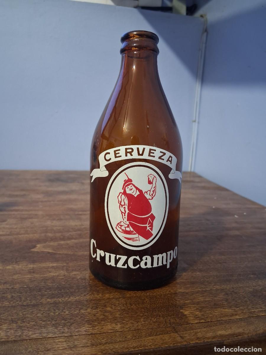 Coleccionismo de cervezas: Botella de cerveza Cruzcampo tercio Sevilla La Cruz del Campo