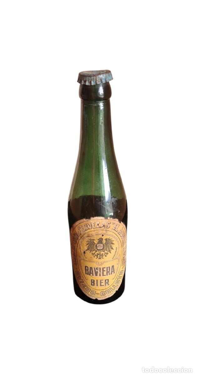 Coleccionismo de cervezas: (CE-260600)Botella cerveza BAVIERA BIER-EL AGUILA NEGRA,TERCIO,COLLOTO-OVIEDO,VIDRIO VERDE