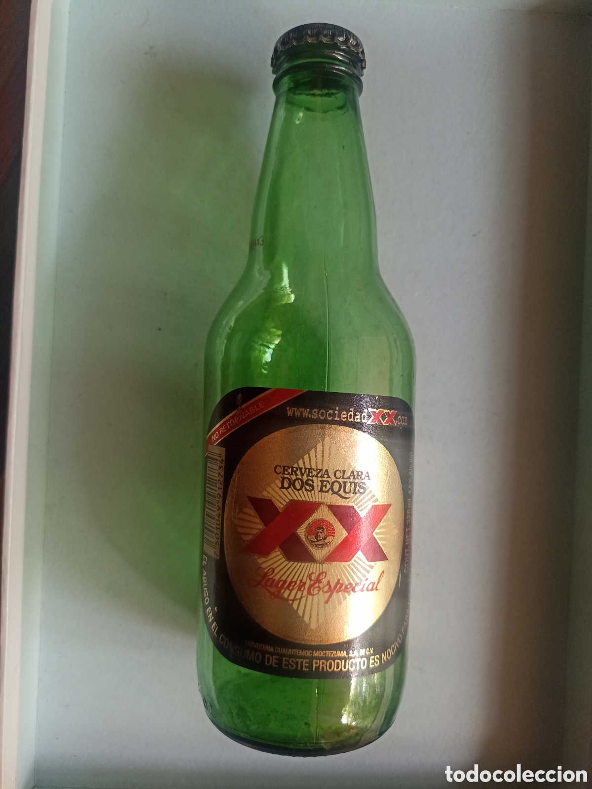Coleccionismo de cervezas: Botella cerveza Dos equis M&eacute;xico vac&iacute;a con chapa 325 ml