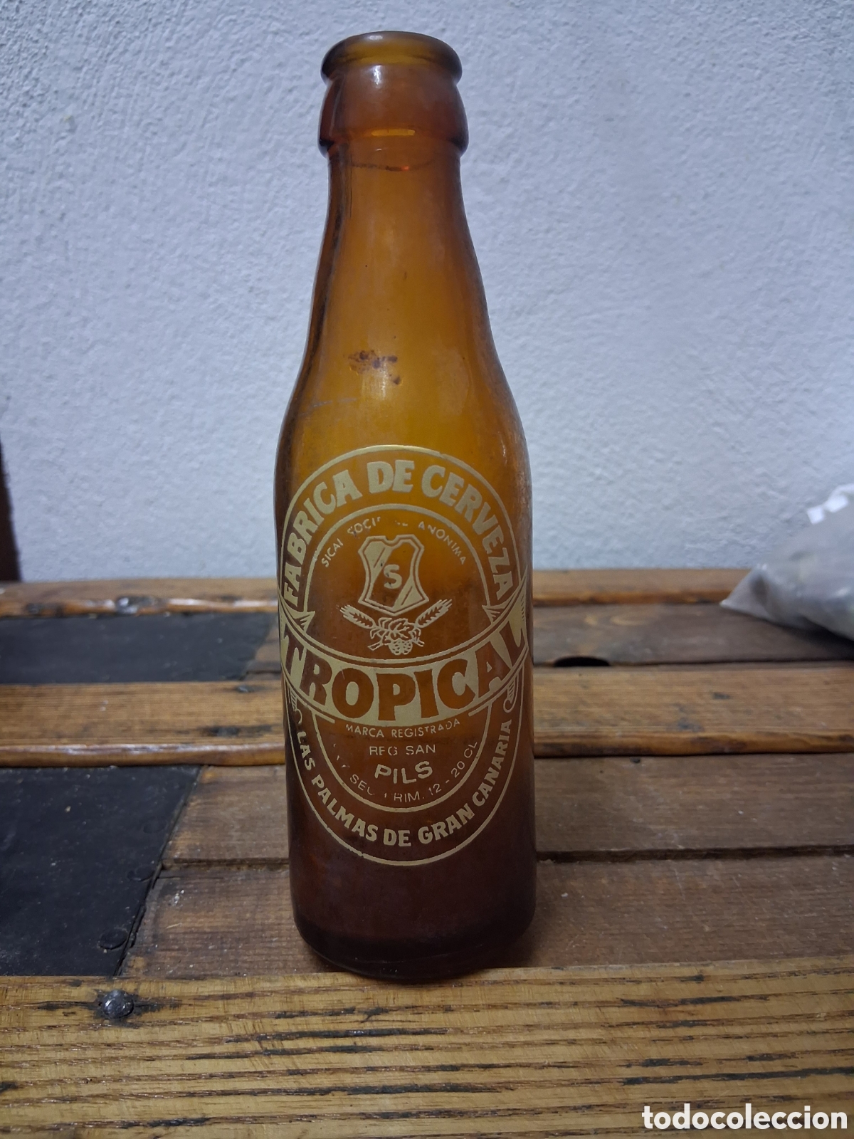 Coleccionismo de cervezas: Botella de cerveza Tropical Las Palmas de Gran Canaria quinto