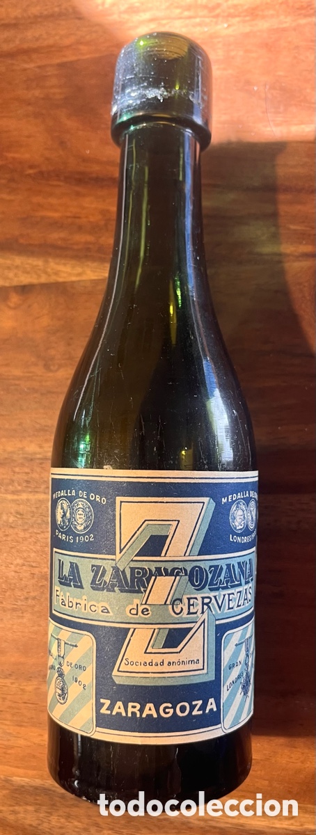 Coleccionismo de cervezas: Muy antigua botella cerveza la Zaragozana etiqueta papel tapon corcho