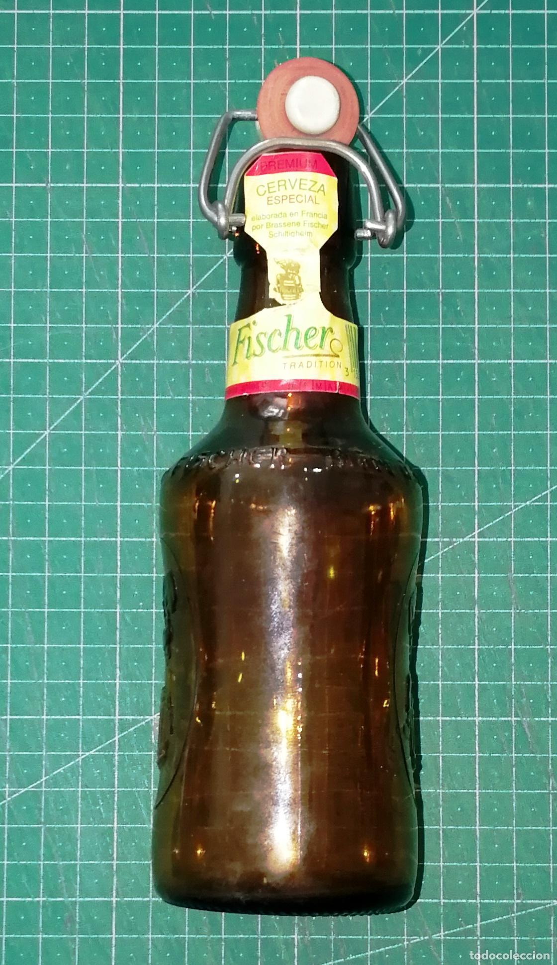 Coleccionismo de cervezas: BOTELLA CERVEZA. FISCHER. Logo grabado en el cristal. - Francia, A&ntilde;os 90. - 33 cl. - Altura 21 cm