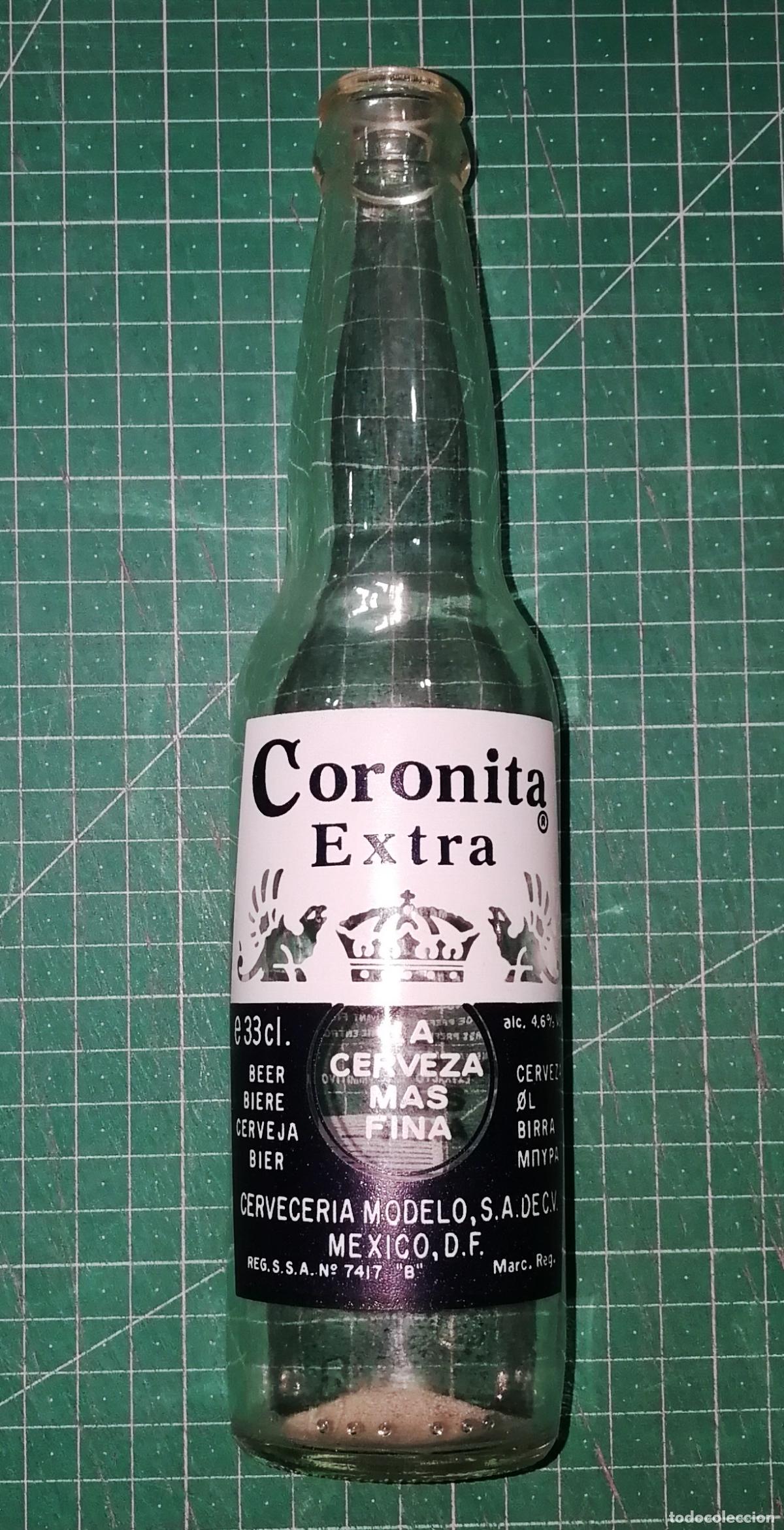 Coleccionismo de cervezas: BOTELLA CERVEZA. CORONITA EXTRA. Serigrafiada. - M&eacute;xico, A&ntilde;os 90. - 33 cl. - Altura aprox. 24 cm